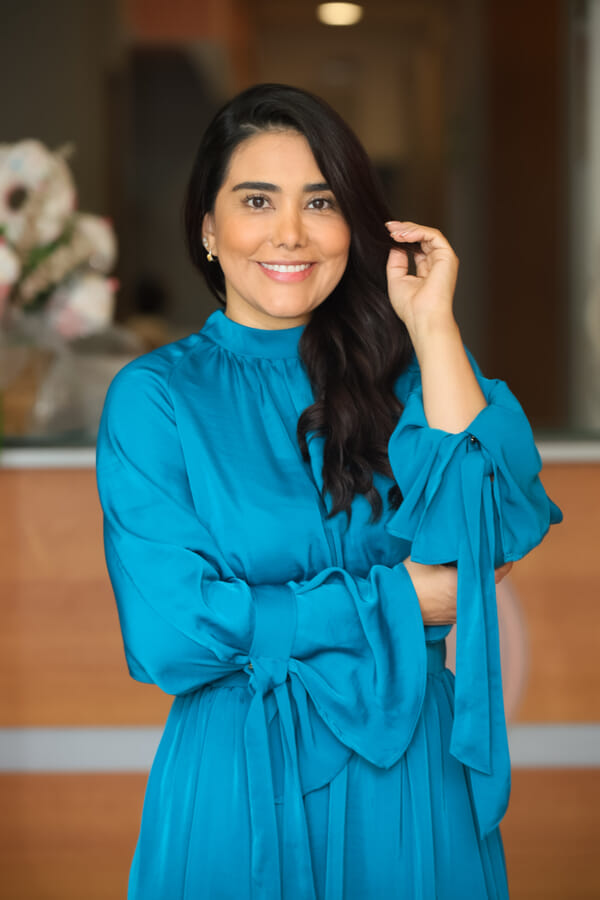 Esthetics studio owner at her Costa Rica salon, relaxed professional portrait