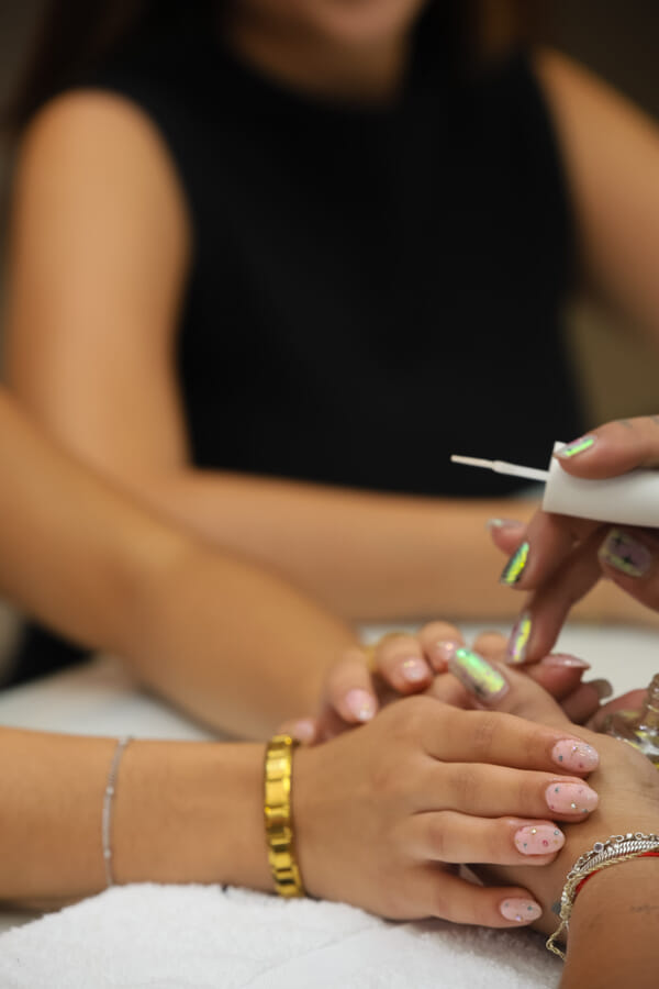 Finished nail design close-up at a Costa Rica esthetics salon, crisp after-shot detail